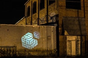 Open Bench Project Logo projected onto building exterior